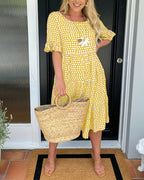 Lila A-line dress in soft lavender with white polka dots and ruffle sleeves. 9
