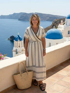 Lila V-neck short sleeve wrap midi dress in soft lavender, featuring a flowy silhouette and lightweight fabric. 3