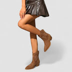 Women's orthopedic suede-look western ankle boots with contrast stitching and a stacked heel.