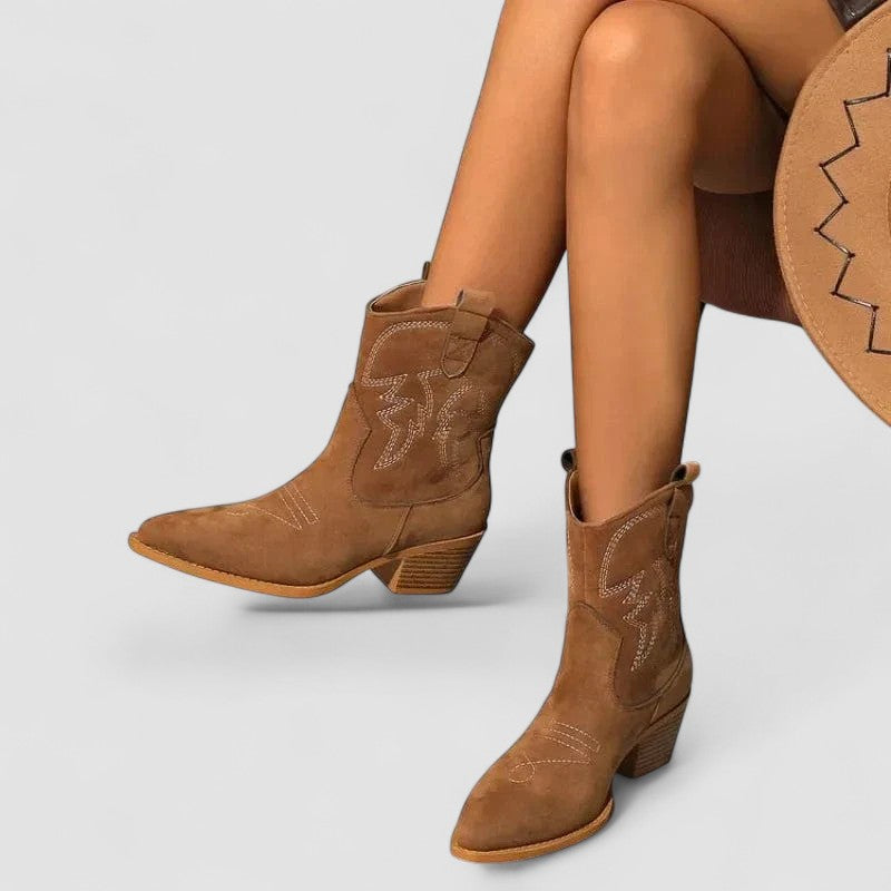 Women's orthopedic suede-look western ankle boots with contrast stitching and a stacked heel.