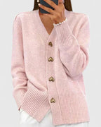 Soft pink knit cardigan for women with gold-tone heart buttons and a V-neckline.