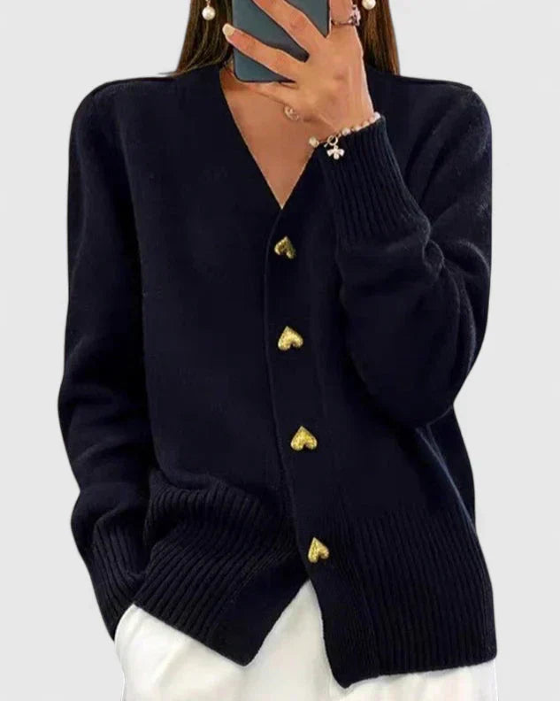 Knit cardigan for women with gold-tone heart buttons and a V-neckline.
