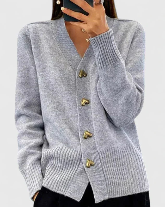 Knit cardigan for women with gold-tone heart buttons and a V-neckline.
