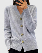 Knit cardigan for women with gold-tone heart buttons and a V-neckline.