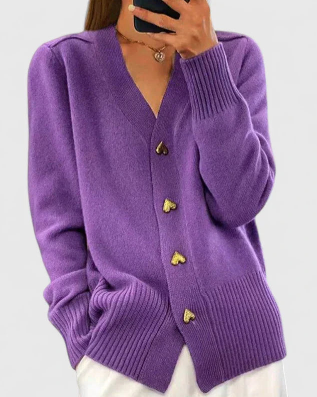 Knit cardigan for women with gold-tone heart buttons and a V-neckline.