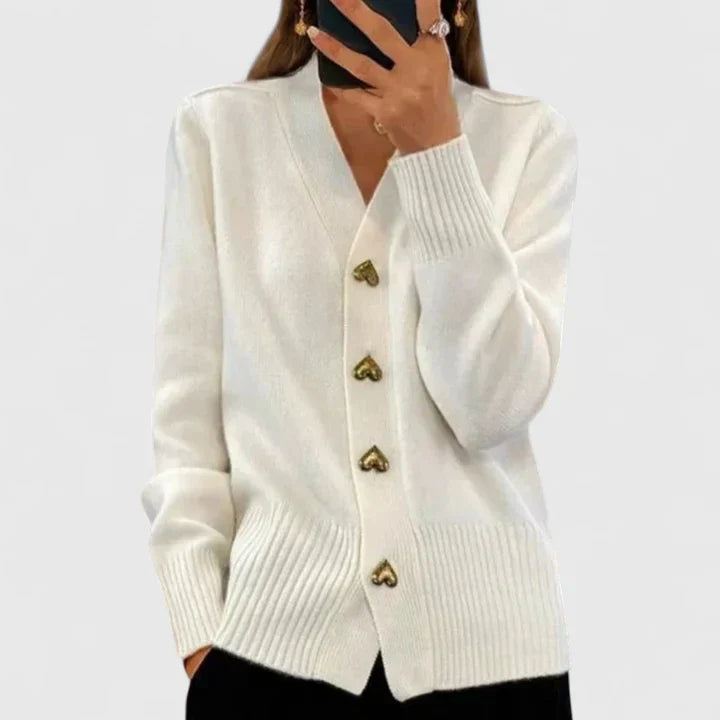 Knit cardigan for women with gold-tone heart buttons and a V-neckline.