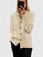 Knit cardigan for women with gold-tone heart buttons and a V-neckline.