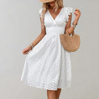 Lightweight summer dress in soft pink with flutter sleeves, perfect for casual outings. 1