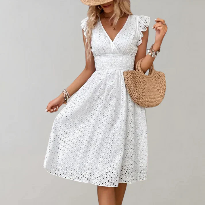 Lightweight summer dress in soft pink with flutter sleeves, perfect for casual outings. 1