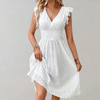 Lightweight summer dress in soft pink with flutter sleeves, perfect for casual outings. 2