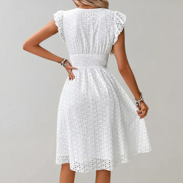 Lightweight summer dress in soft pink with flutter sleeves, perfect for casual outings. 4