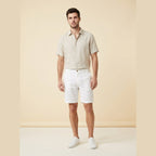 Light beige linen shorts with a relaxed fit and drawstring closure, perfect for casual summer wear. 0