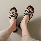 Tan woven flat slides with a casual, bohemian style perfect for relaxed summer outings. 4