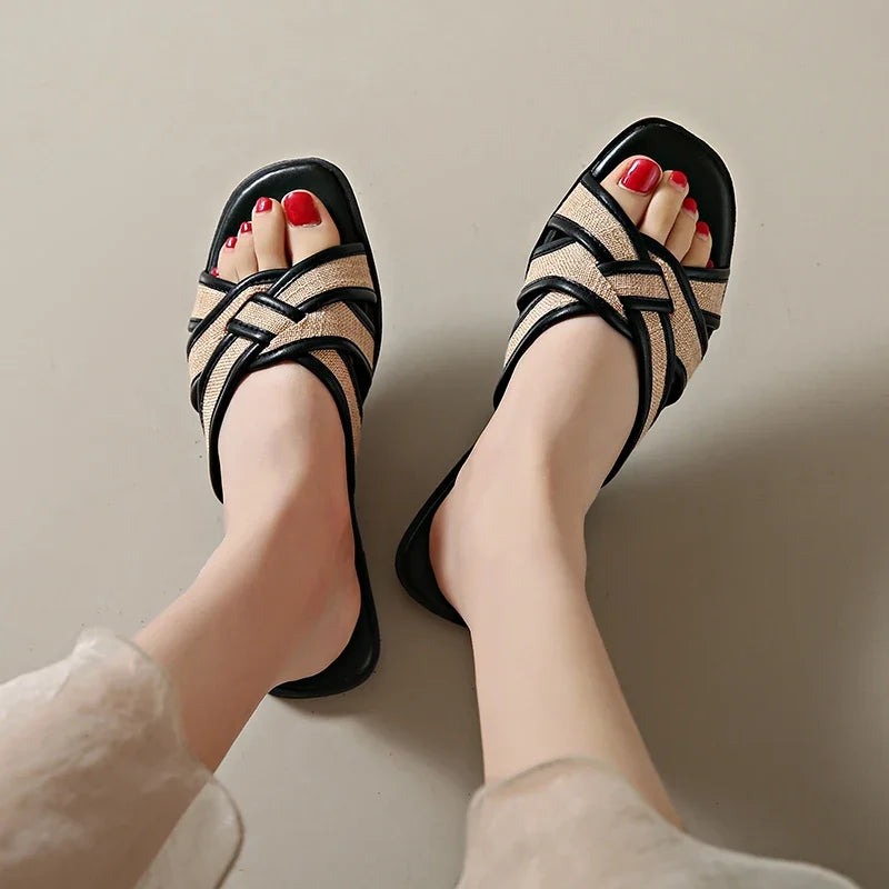 Tan woven flat slides with a casual, bohemian style perfect for relaxed summer outings. 4