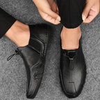 Brown leather slip-ons with elastic lacing and a non-slip sole, featuring a sleek and casual design. 2