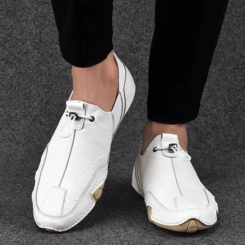 Brown leather slip-ons with elastic lacing and a non-slip sole, featuring a sleek and casual design. 3