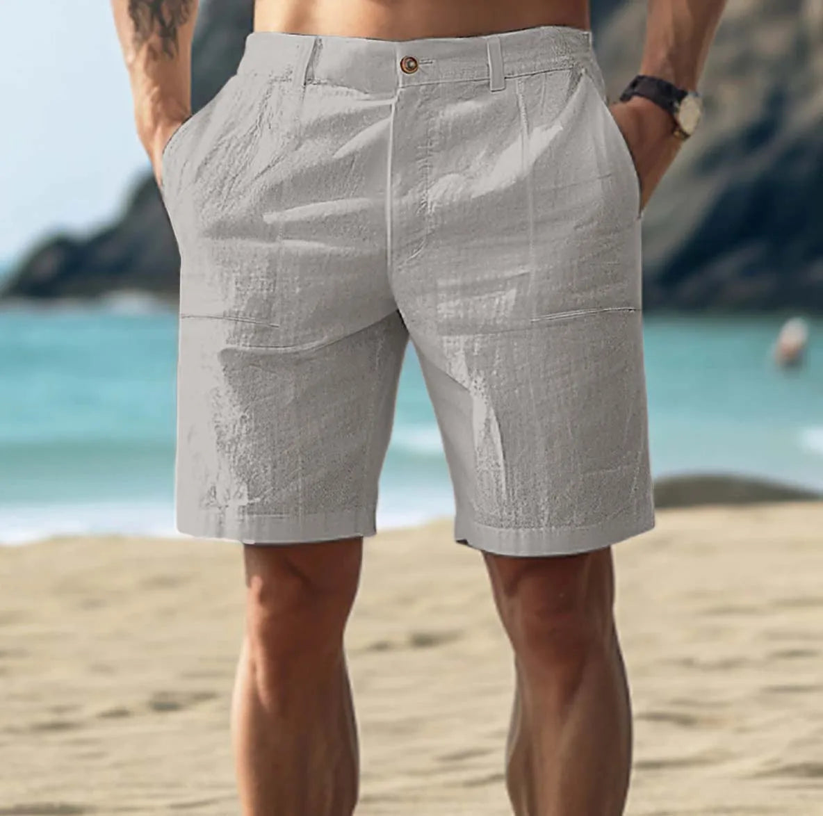 Light beige linen shorts in a relaxed, casual style perfect for warm weather outings. 2