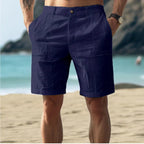 Light beige linen shorts in a relaxed, casual style perfect for warm weather outings. 3