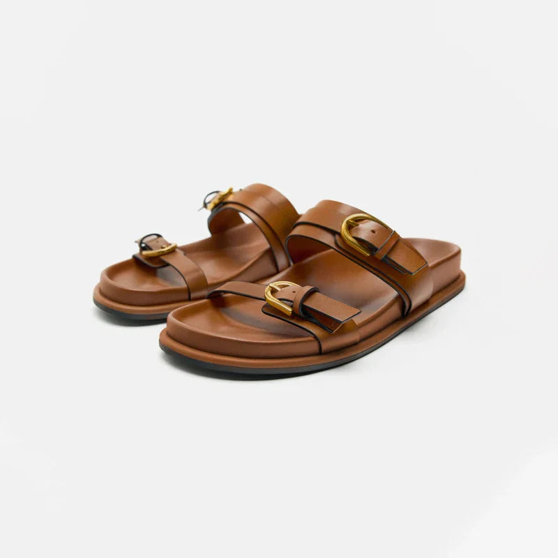 Elegant tan leather sandals for women, featuring a minimalist design with a comfortable flat sole. 0