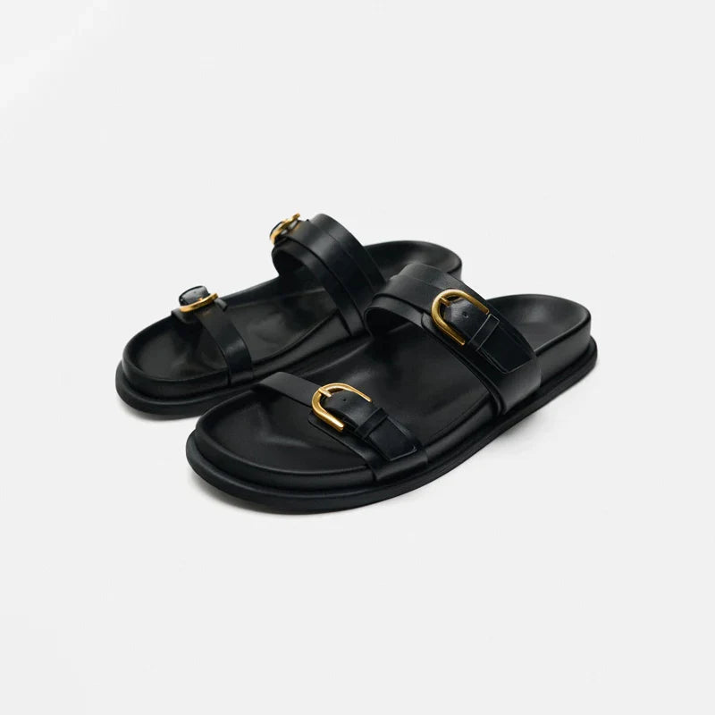 Elegant tan leather sandals for women, featuring a minimalist design with a comfortable flat sole. 1