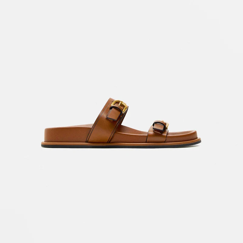 Elegant tan leather sandals for women, featuring a minimalist design with a comfortable flat sole. 3