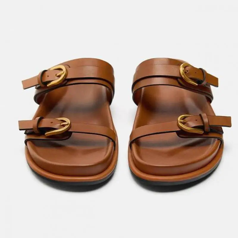 Elegant tan leather sandals for women, featuring a minimalist design with a comfortable flat sole. 4
