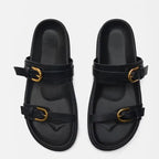 Elegant tan leather sandals for women, featuring a minimalist design with a comfortable flat sole. 6