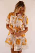 Light blue mini dress with lace trim and puff sleeves, featuring a playful and feminine style. 4