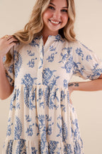 A blue tiered midi dress with a relaxed fit, featuring a wavy pattern perfect for casual summer outings. 1