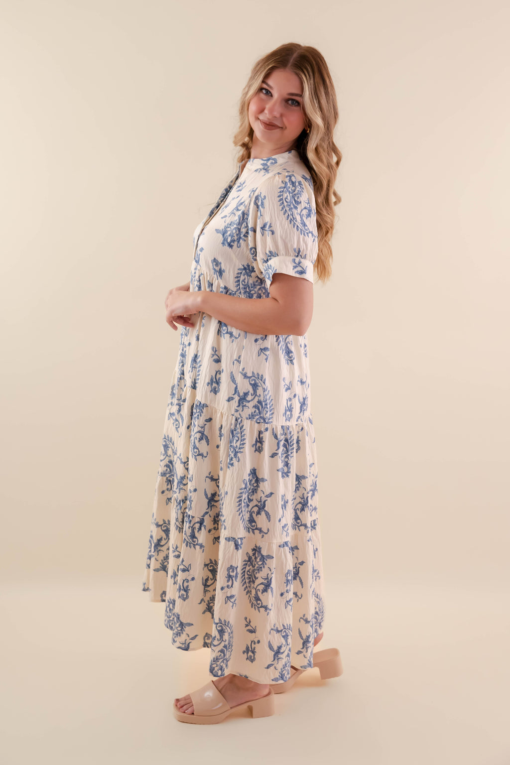 A blue tiered midi dress with a relaxed fit, featuring a wavy pattern perfect for casual summer outings. 3