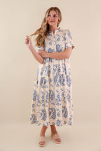 A blue tiered midi dress with a relaxed fit, featuring a wavy pattern perfect for casual summer outings. 4