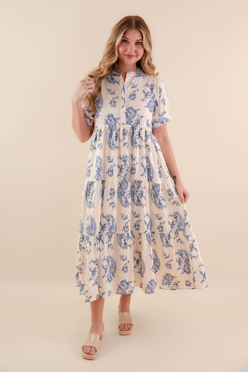 A blue tiered midi dress with a relaxed fit, featuring a wavy pattern perfect for casual summer outings. 5