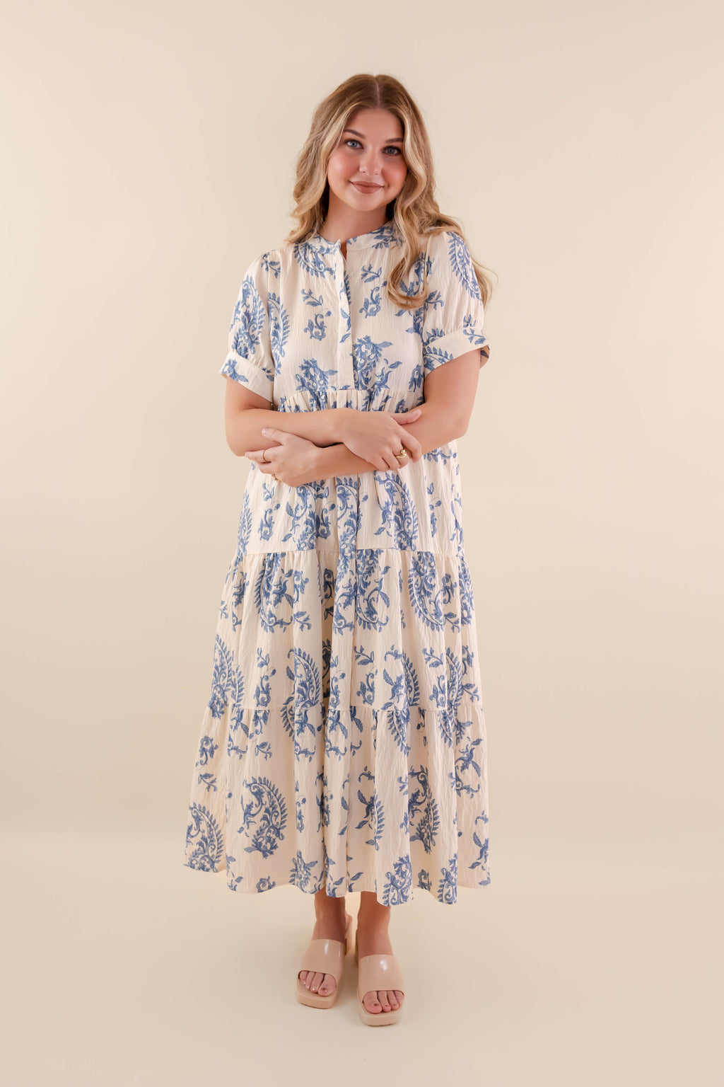 A blue tiered midi dress with a relaxed fit, featuring a wavy pattern perfect for casual summer outings. 6