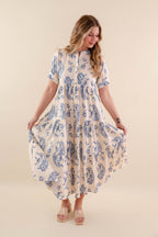 A blue tiered midi dress with a relaxed fit, featuring a wavy pattern perfect for casual summer outings. 7
