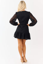 Black floral lace mini dress featuring long sleeves and a ruffled hem. 6