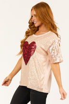 Rose gold sequin top with short sleeves and boatneck, featuring a chic and stylish design. 4