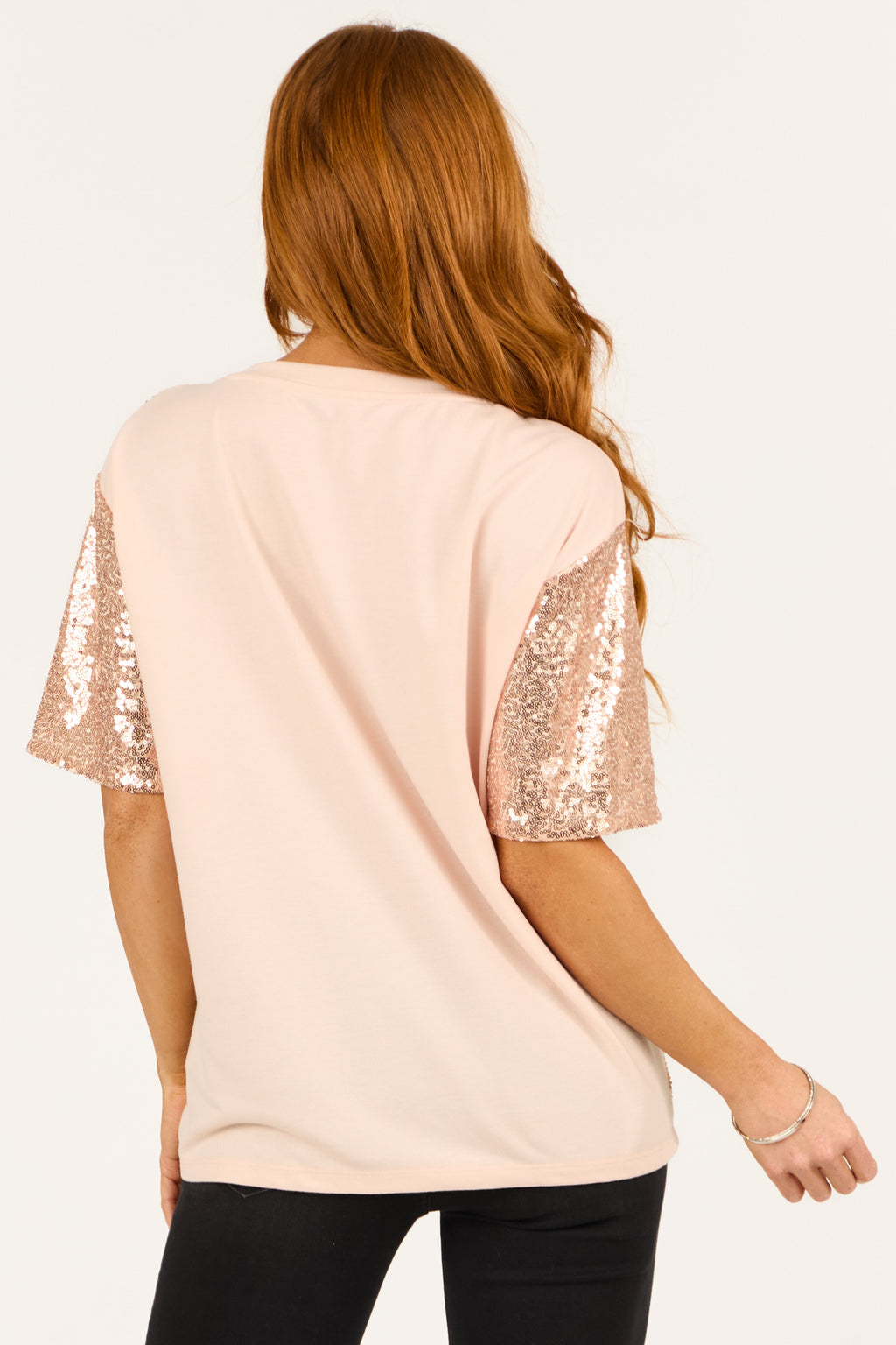 Rose gold sequin top with short sleeves and boatneck, featuring a chic and stylish design. 5