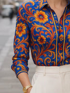 Floral print long sleeve blouse in soft cream with buttoned lapel, featuring a relaxed and feminine style. 3