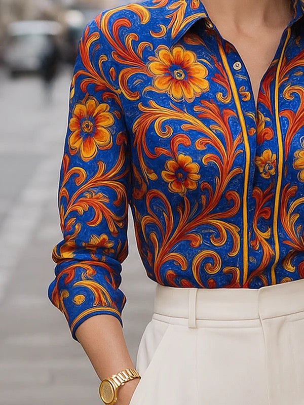 Floral print long sleeve blouse in soft cream with buttoned lapel, featuring a relaxed and feminine style. 3