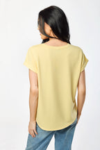 Light gray short sleeve sweatshirt with a relaxed fit and side slits, offering a casual and comfortable style. 2
