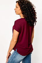 Light gray short sleeve sweatshirt with a relaxed fit and side slits, offering a casual and comfortable style. 5