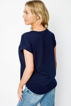 Light gray short sleeve sweatshirt with a relaxed fit and side slits, offering a casual and comfortable style. 7