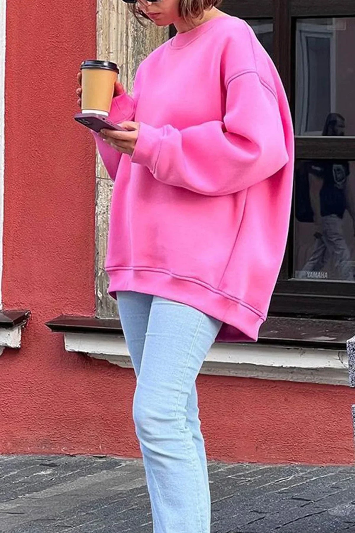 Marente oversized sweatshirt in pink, worn walking