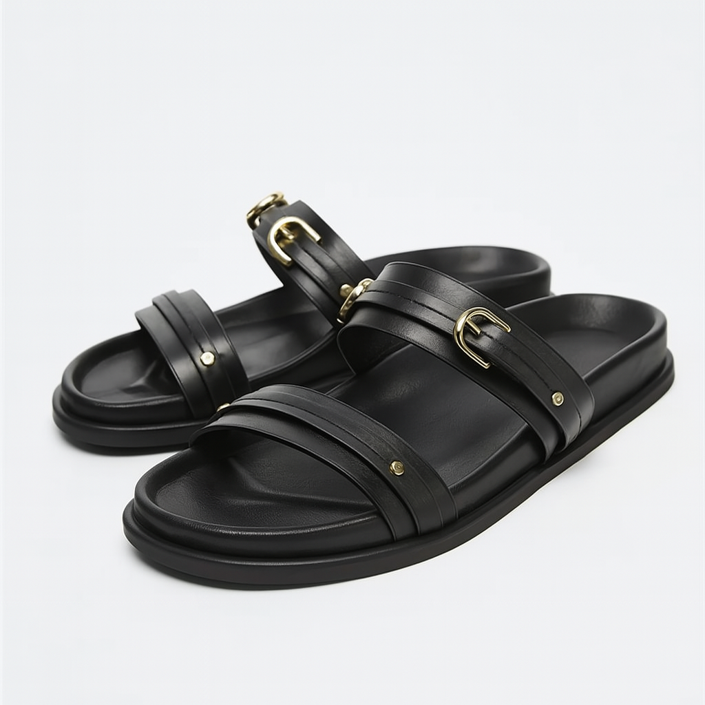 Black twin strap flats with a simple, minimalist design, perfect for casual or dressy occasions. 1