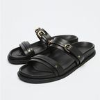 Black twin strap flats with a simple, minimalist design, perfect for casual or dressy occasions. 1