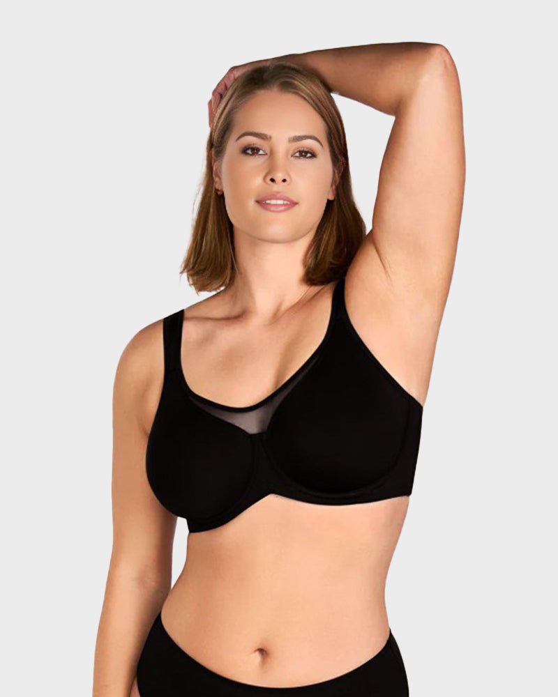 Marieke plus size minimizer bra in black, front view with arm raised