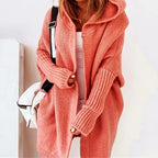 Loose knit oversized cardigan for women with a generous hood and longline cut.