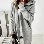 Loose knit oversized cardigan for women with a generous hood and longline cut.