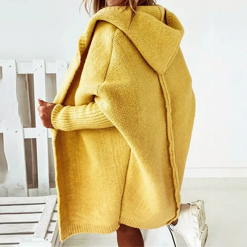 Loose knit oversized cardigan for women with a generous hood and longline cut.