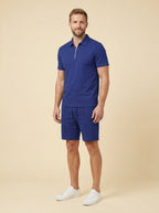 Men's summer set in navy blue, featuring a breathable zipper polo shirt and matching shorts in a casual style. 2
